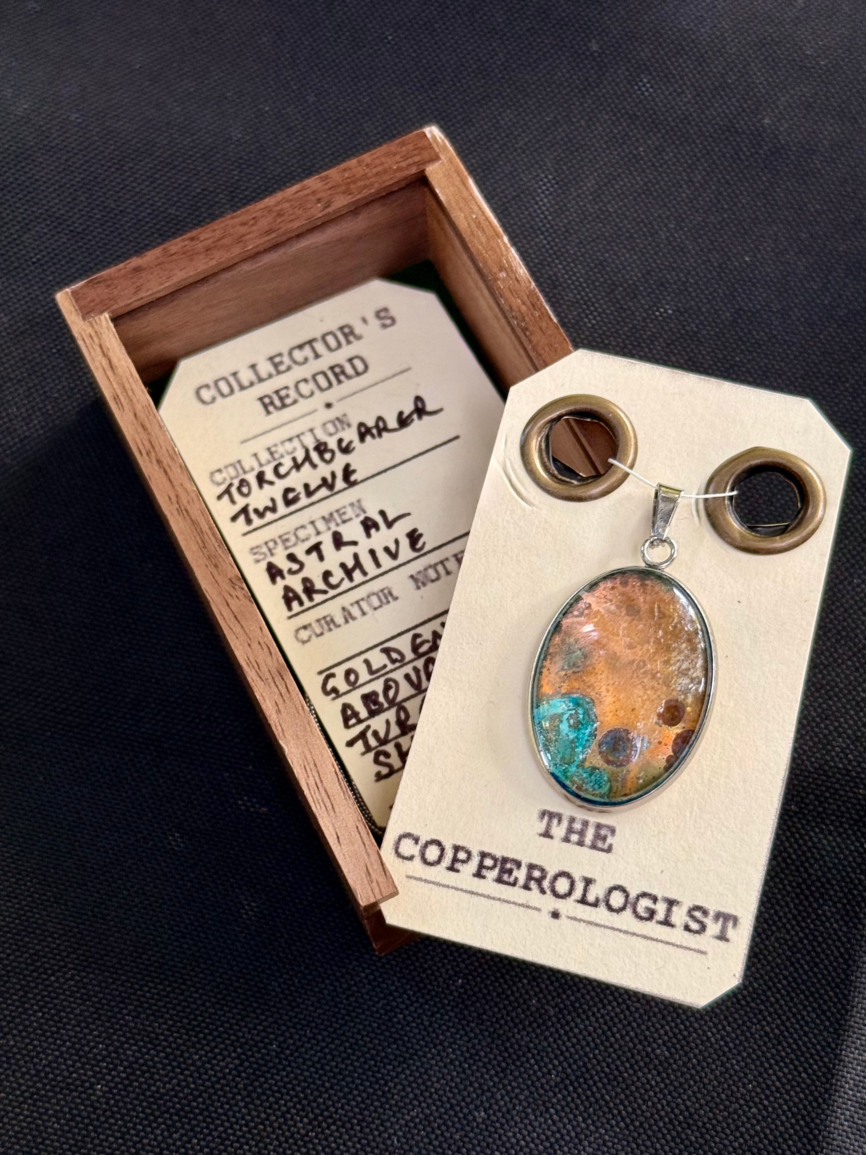 Astral Archive - a one-of-a-kind copper pendant, presented in its wooden collector’s box with The Copperologist’s Collector’s Record card