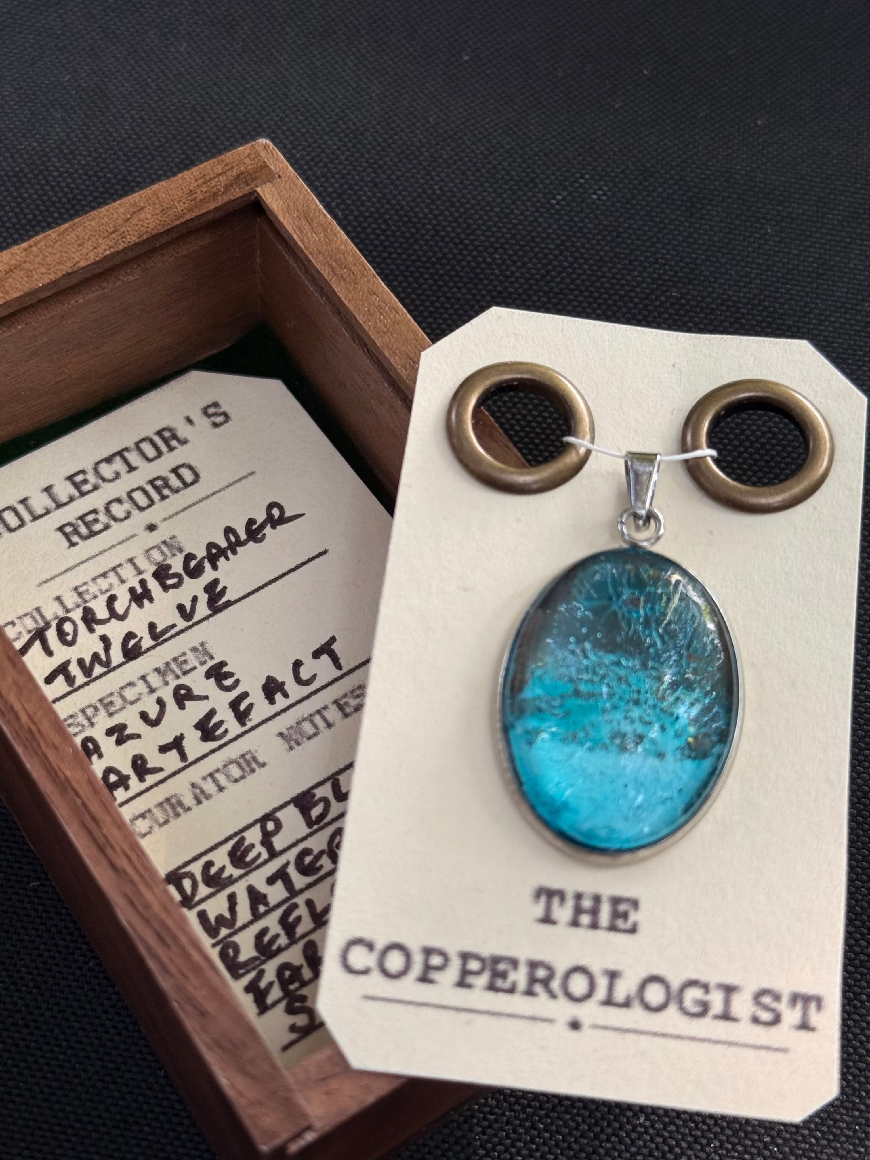 Azure Artefect - a one-of-a-kind copper pendant, presented in its wooden collector’s box with The Copperologist’s Collector’s Record card