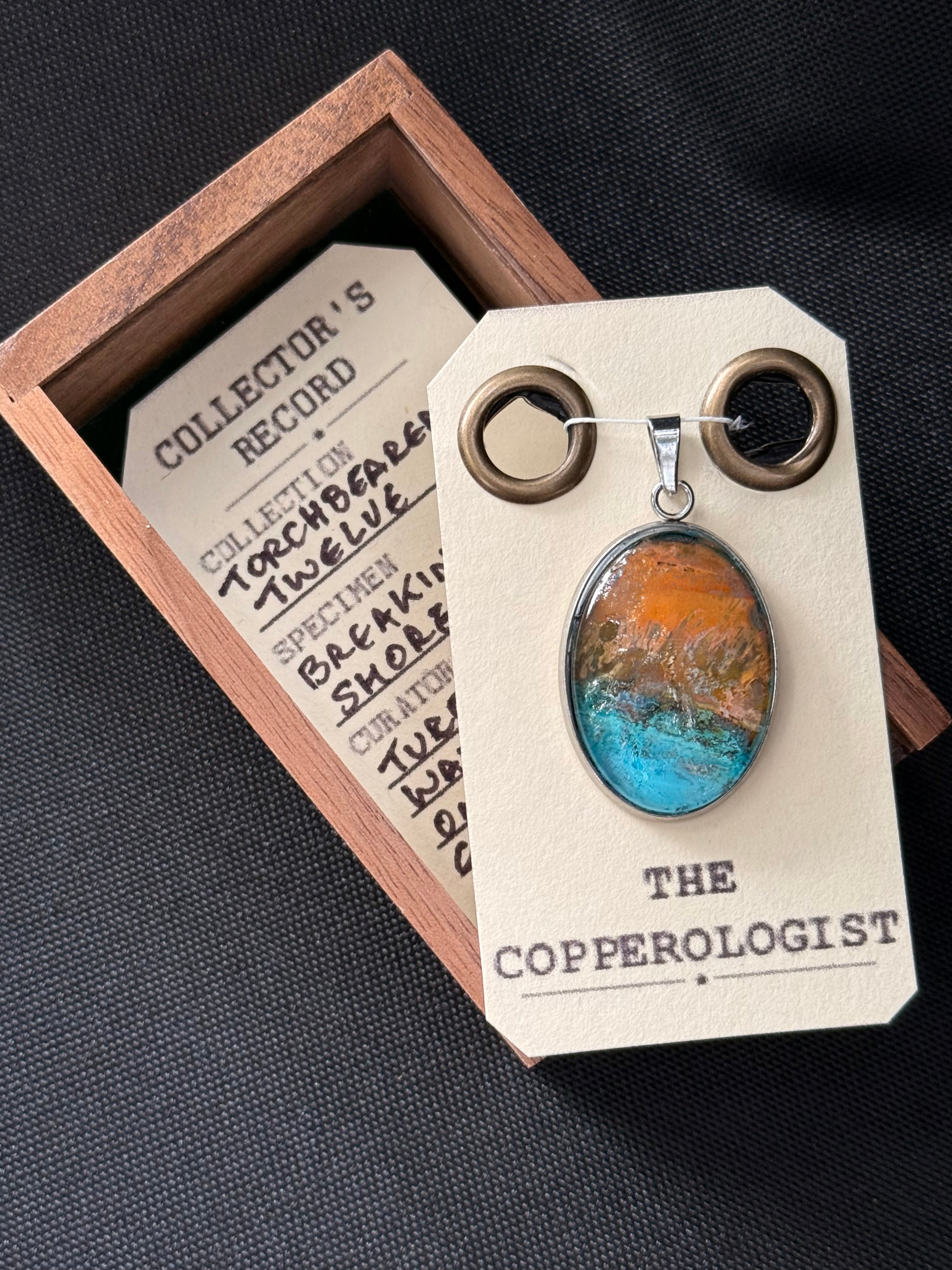 Breaking Shore - a one-of-a-kind copper pendant, presented in its wooden collector’s box with The Copperologist’s Collector’s Record card