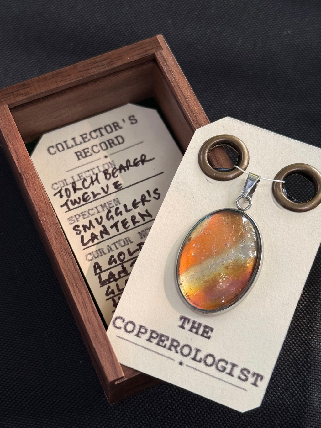 Smuggler's Lantern - a one-of-a-kind copper pendant, presented in its wooden collector’s box with The Copperologist’s Collector’s Record card