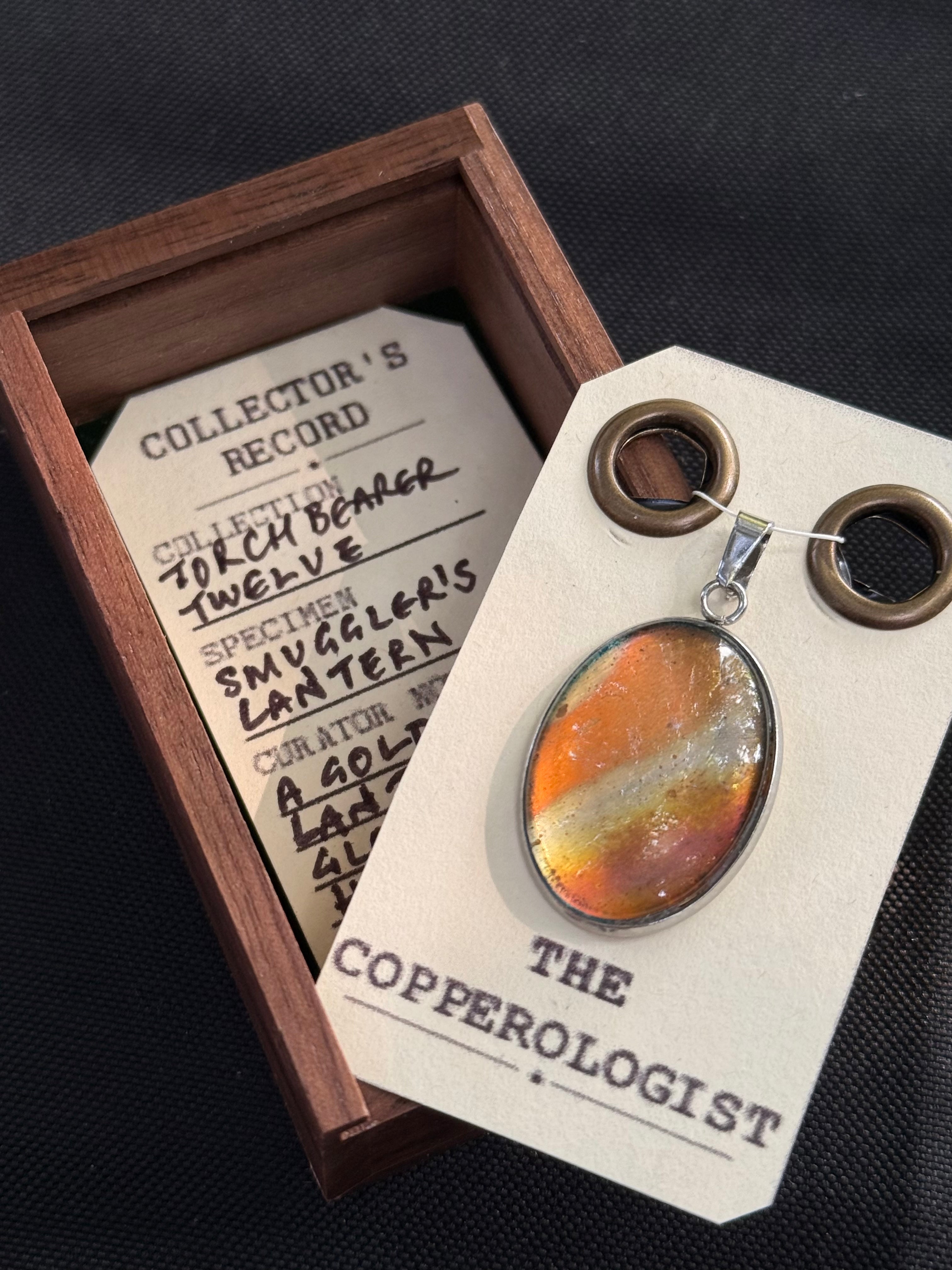 Smuggler's Lantern - a one-of-a-kind copper pendant, presented in its wooden collector’s box with The Copperologist’s Collector’s Record card