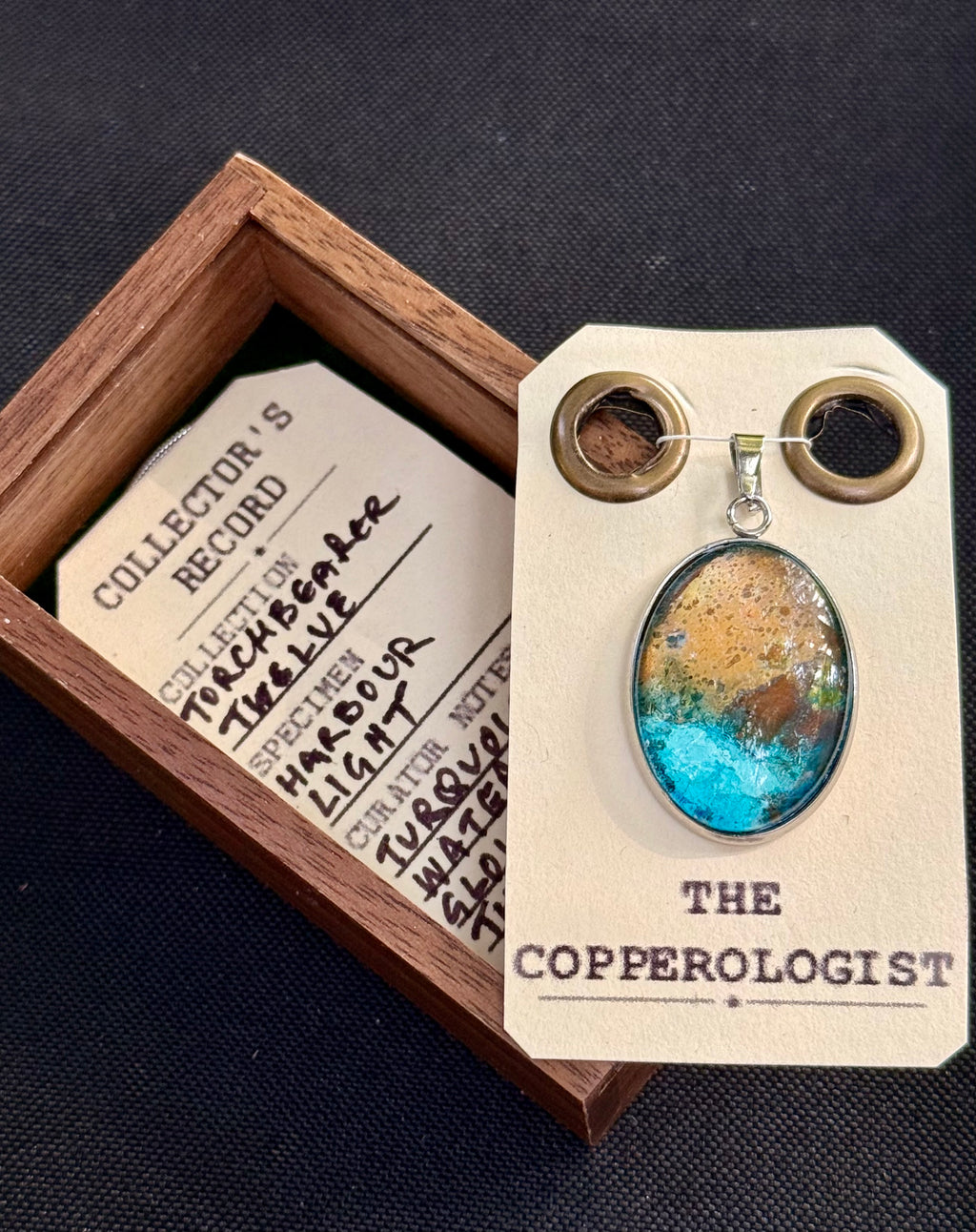 Harbour Light - a one-of-a-kind copper pendant, presented in its wooden collector’s box with The Copperologist’s Collector’s Record card