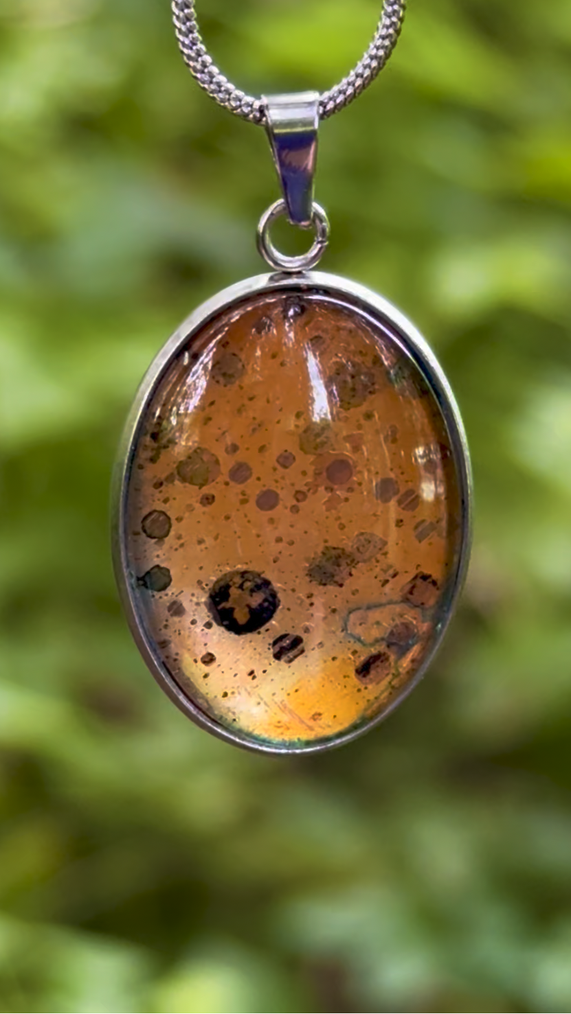 Torchbearer Twelve Specimen Twelve wearable copper specimen pendant displaying rich golden copper tones with distinctive circular mineral formations and naturally occurring patina patterns.