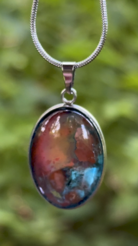 Torchbearer Twelve Specimen Six wearable copper specimen pendant displaying iridescent copper, rose, turquoise and mineral colours resembling an ancient oxidised artefact.