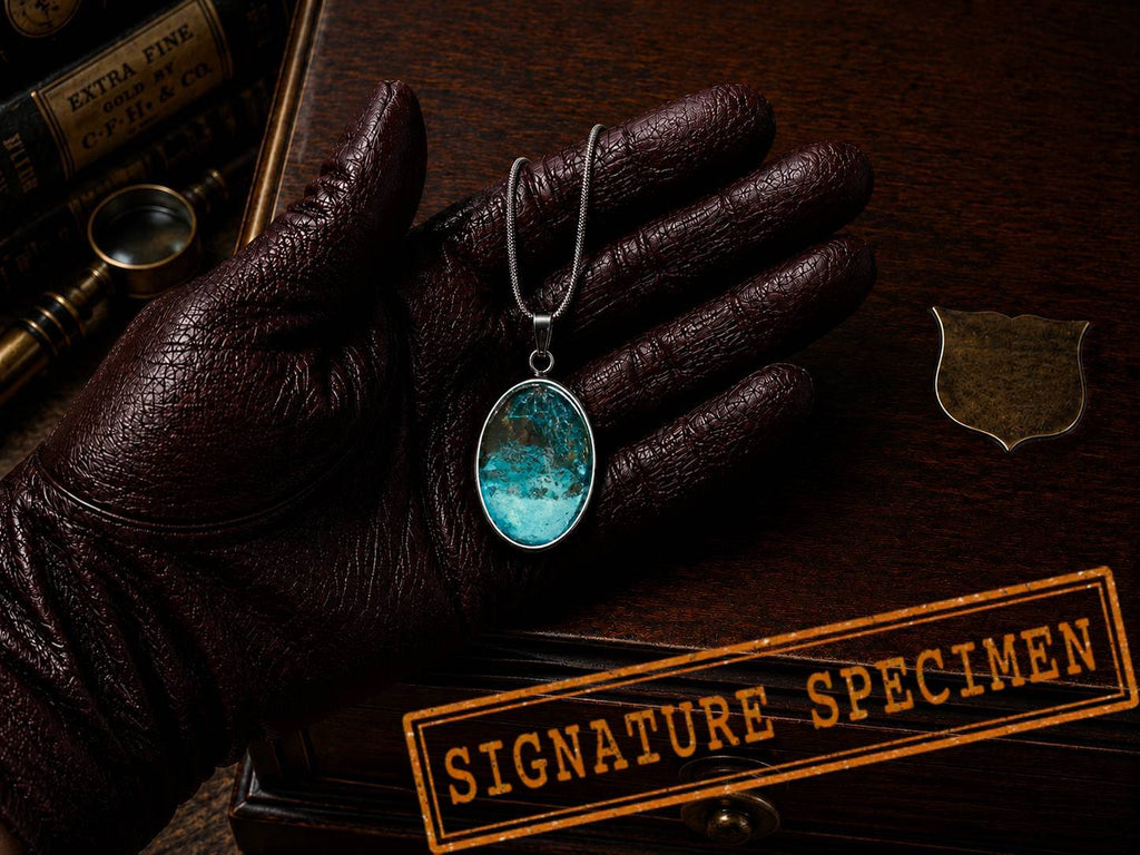 wearable copper specimen pendant displaying intense turquoise colouration and intricate crystalline textures developed through proprietary alchemical processes. For a collector who loves the sea.