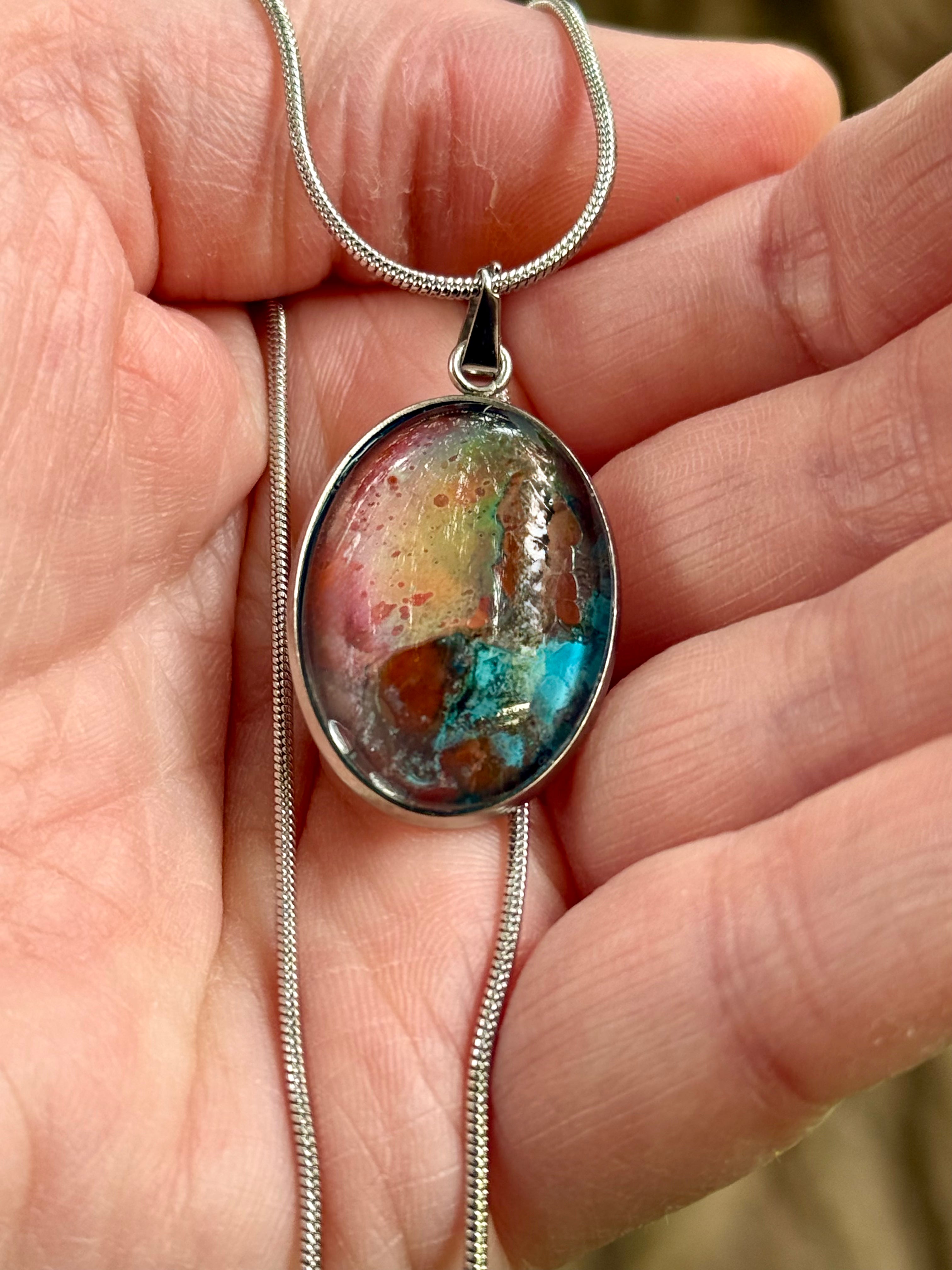 Torchbearer Twelve Specimen Six wearable copper specimen pendant displaying iridescent copper, rose, turquoise and mineral colours resembling an ancient oxidised artefact.
