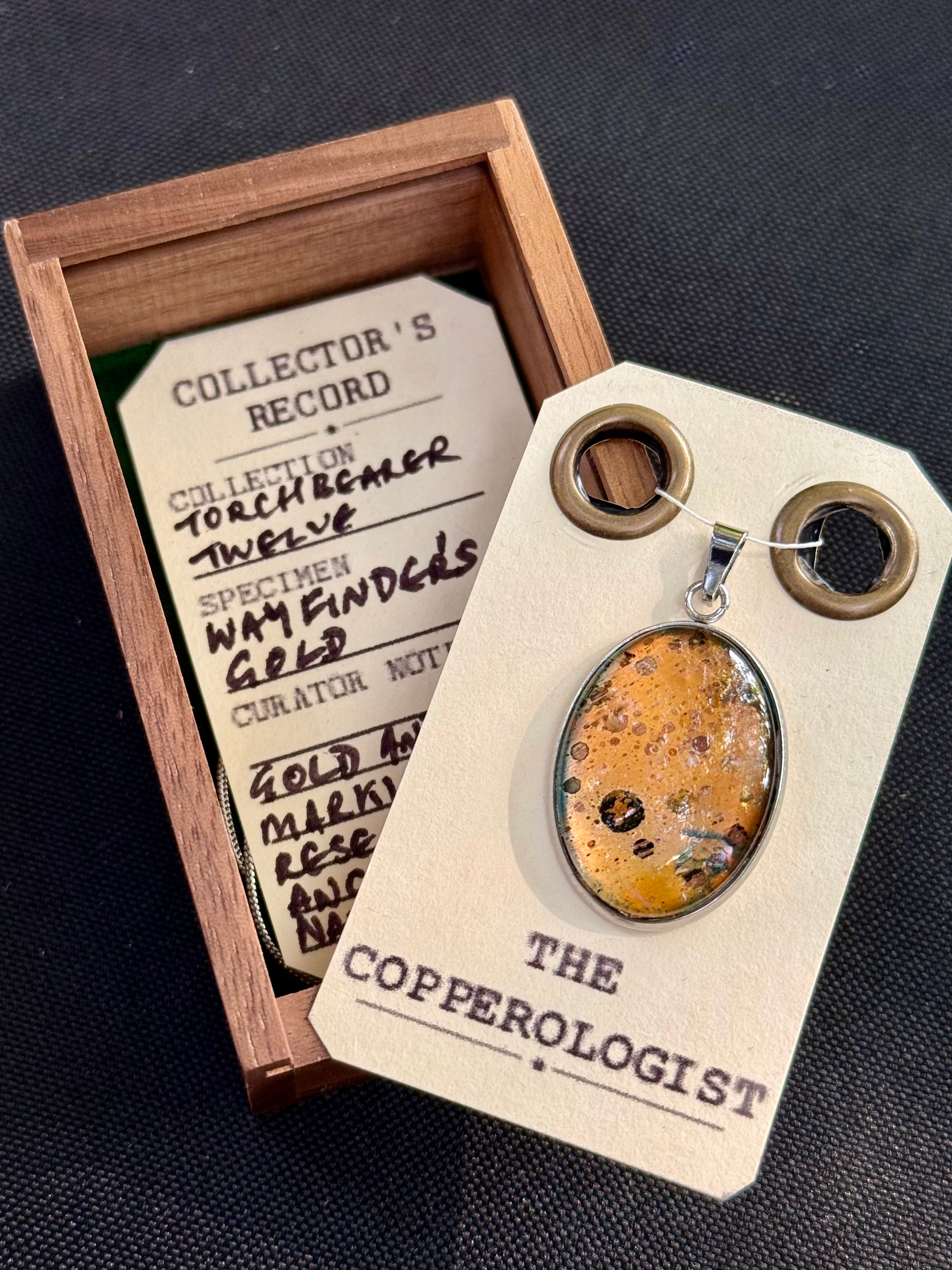 Wayfinder's Gold - a one-of-a-kind copper pendant, presented in its wooden collector’s box with The Copperologist’s Collector’s Record card